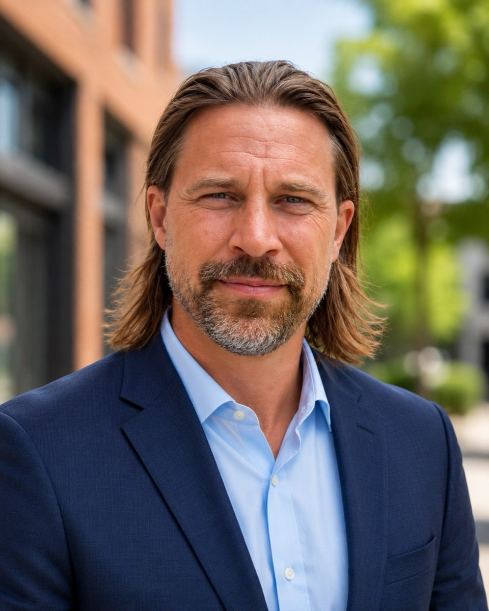 Kurt Hayley, broker, standing outside in downtown